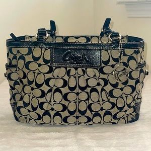 Coach black and cram colored purse